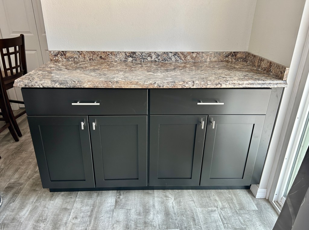 Coffee bar with gray shaker cabinets and granite countertop in Citrus Hills, Florida